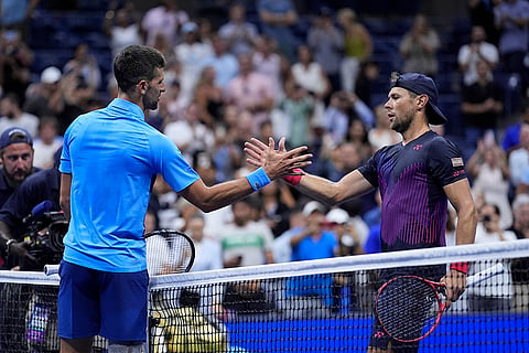 US Open 2024: Novak Djokovic, of Serbia, greets Radu Albot, of Moldova